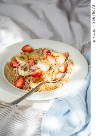 Oatmeal with banana, strawberries and peanut Oatmeal with banana, strawberries and peanut 56676072