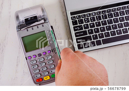 Customer paying with contactless card payment in Customer paying with contactless card payment in 56678799