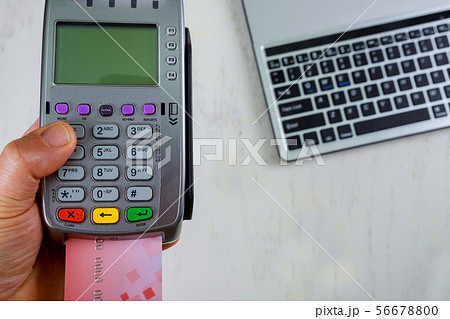 Hand with credit card making payment transaction 56678800