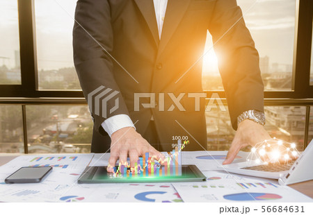businessman analyze graphs with computers businessman analyze graphs with computers 56684631