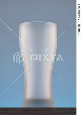 Empty beer glass. Isolated on grey background Empty beer glass. Isolated on grey background 56686784