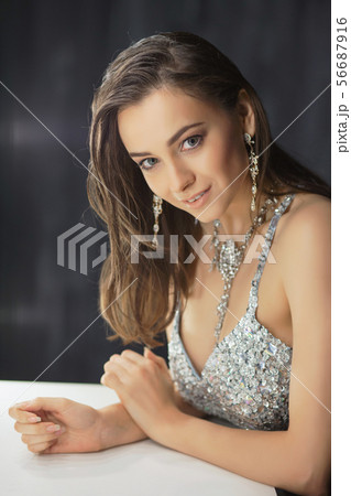 Lovely young lady posing in a studio. 56687916