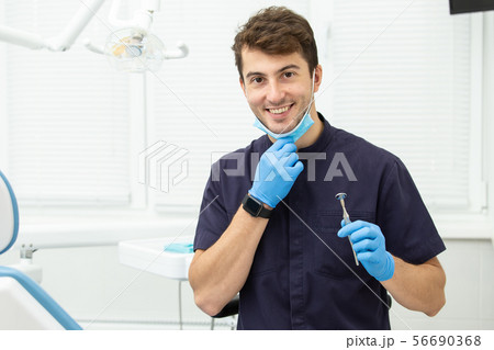 Dental polymerization lamp with UV light and laser. Stomatological instrument in the dentist clinic 56690368