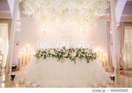 Floral elements of roof. Decorated chandelier on wedding 56690985