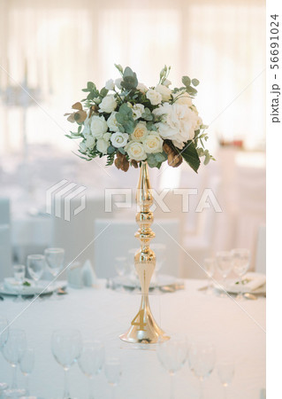 Wedding bouquet on the table in restaurant 56691024
