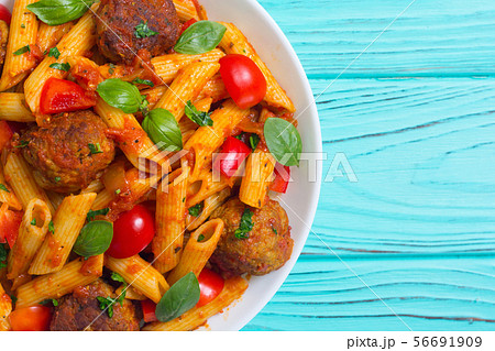 Italian penne pasta with meatballs and tomatoes 56691909