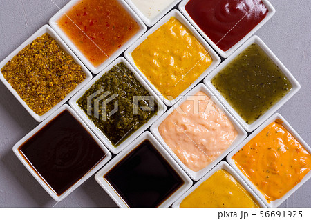 Set of different sauces in ceramic bowl 56691925