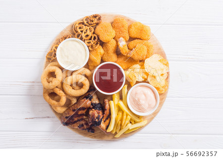 Onion rings , nuggets grilled wings , french fries Onion rings , nuggets grilled wings , french fries 56692357