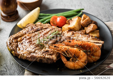 surf and turf, ribeye steak and grilled prawn surf and turf, ribeye steak and grilled prawn 56692620