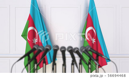 Azerbaijani official press conference. Flags of Azerbaijan and microphones. Conceptual 3D rendering Azerbaijani official press conference. Flags of Azerbaijan and microphones. Conceptual 3D rendering 56694468