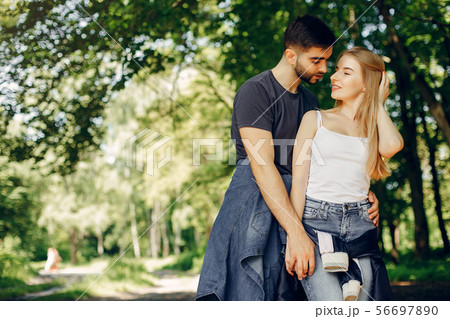 Beautiful couple spend time on a summer forest 56697890