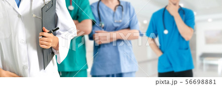 Doctor working in hospital with other doctors. 56698881