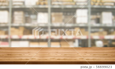 Wood table in warehouse storage blur background. Wood table in warehouse storage blur background. 56699023