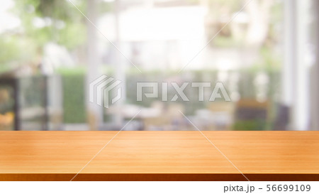 Wood table in blur background of modern restaurant 56699109