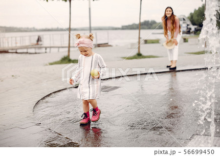 Mother with daughter playing in a summer park 56699450