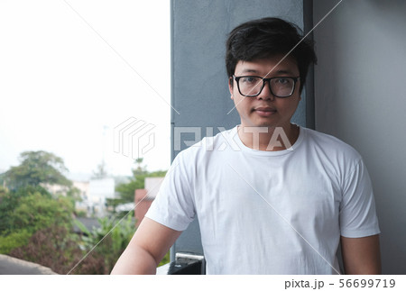 Smart young man with good posture Smart young man with good posture 56699719