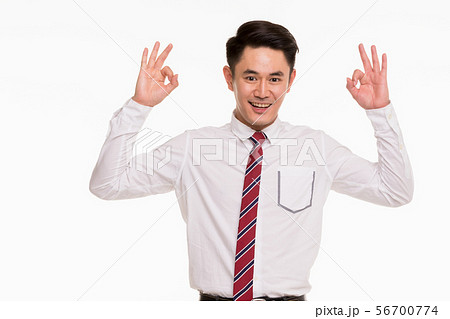 Asian businessman standing and thump up.. 56700774