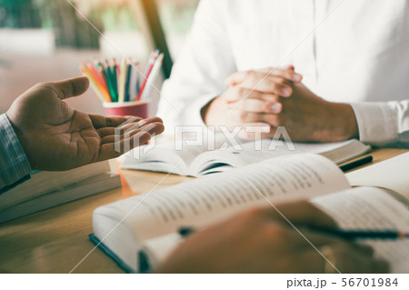 Teenager studying at desk and doing homeworks 56701984