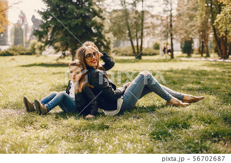 Mother with son playing in a summer park Mother with son playing in a summer park 56702687