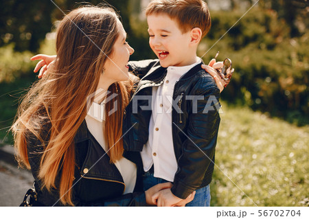 Mother with son playing in a summer park 56702704