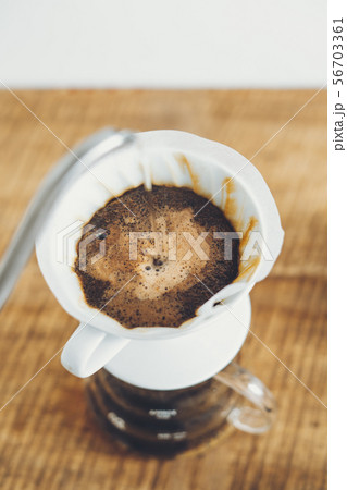 Drip coffee make a cup of coffee On the wood backg Drip coffee make a cup of coffee On the wood backg 56703361