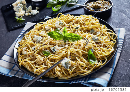 close-up of delicious pasta with basil pesto 56705585