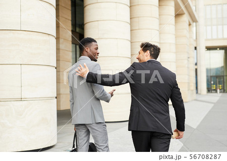 Two businessmen meeting in the city Two businessmen meeting in the city 56708287