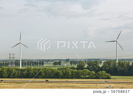 Windmills as wind turbine power generators placed Windmills as wind turbine power generators placed 56708637
