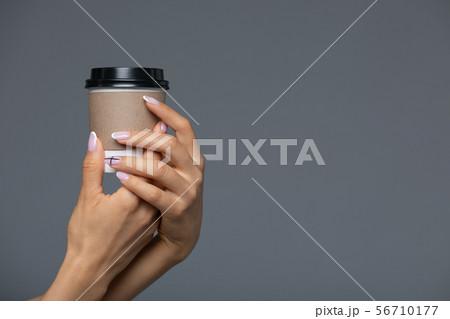 Take Away White Paper Hot Coffee Cup With Right Hand Holding. Take Away White Paper Hot Coffee Cup With Right Hand Holding. 56710177