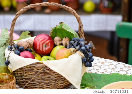 A basket of delicious autumn fruit, grape and A basket of delicious autumn fruit, grape and 56711331