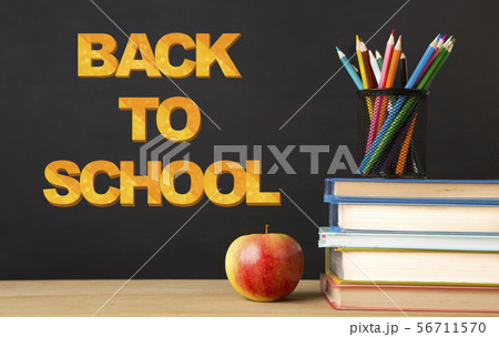 Education background with books, apple and stationery on black 56711570