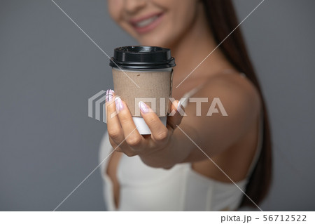 Take Away White Paper Hot Coffee Cup With Right Hand Holding. Take Away White Paper Hot Coffee Cup With Right Hand Holding. 56712522