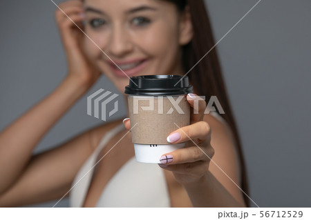 Take Away White Paper Hot Coffee Cup With Right Hand Holding. 56712529