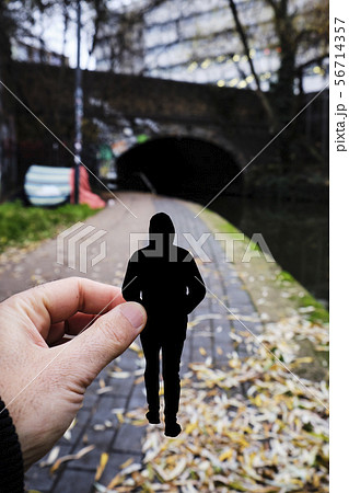 silhouette of a man by the Regents canal, London 56714357