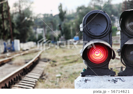 Stop sign at a red traffic light on a railway 56714621