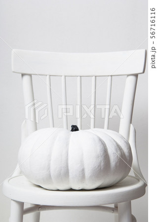 halloween pumpkin on a chair 56716116