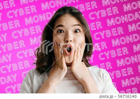 Portrait of young woman on pink background, black friday 56716140