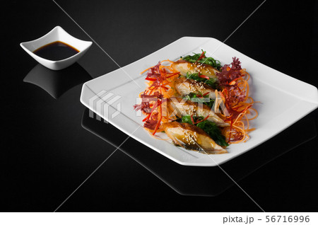 sushi in a plate on a black background 56716996