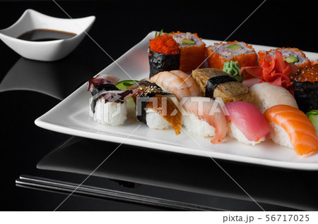 sushi in a plate on a black background 56717025