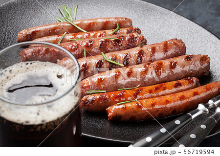 Grilled sausages and beer Grilled sausages and beer 56719594