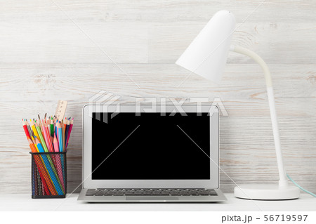 Home office workplace with blank screen laptop Home office workplace with blank screen laptop 56719597