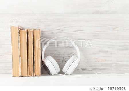 Home office with books and headphones Home office with books and headphones 56719598