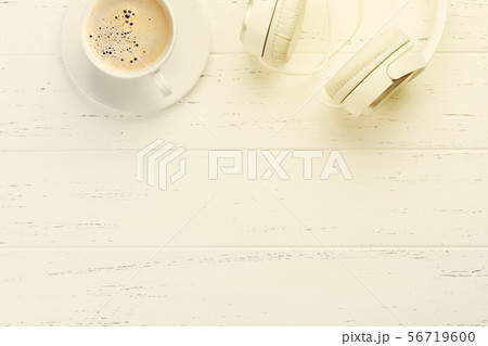 White headphones and coffee cup 56719600
