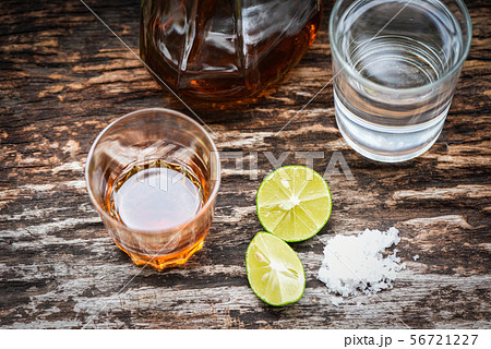 alcoholic drinks and lemon salt on rustic wood alcoholic drinks and lemon salt on rustic wood 56721227