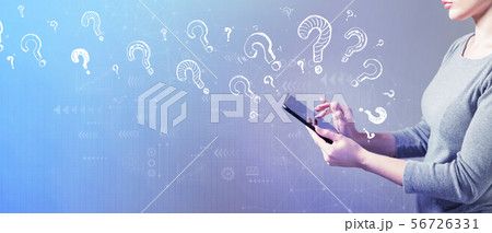 Question marks with woman using a tablet 56726331