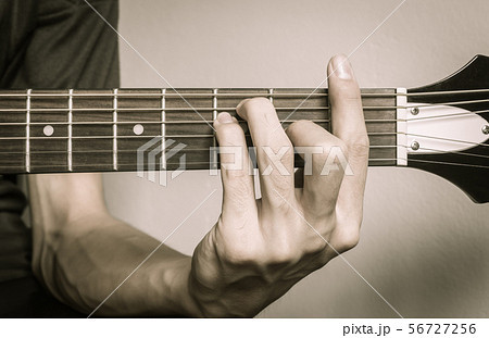 Guitar Player Hand in F Major Chord Vintage Tone 56727256