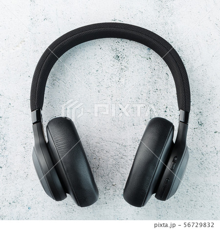 Wireless Black Headphones on a gray stone Wireless Black Headphones on a gray stone 56729832
