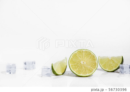 Ice cubes and lime wedge 56730396