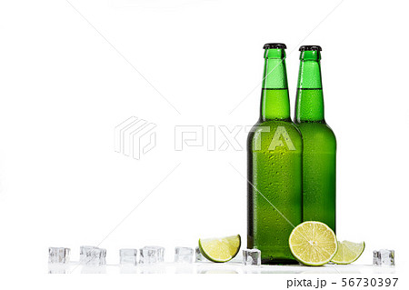 Green bottle of beer and ice cubes Green bottle of beer and ice cubes 56730397