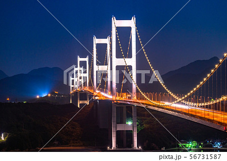 愛媛県 月夜の来島海峡大橋 ライトアップの写真素材